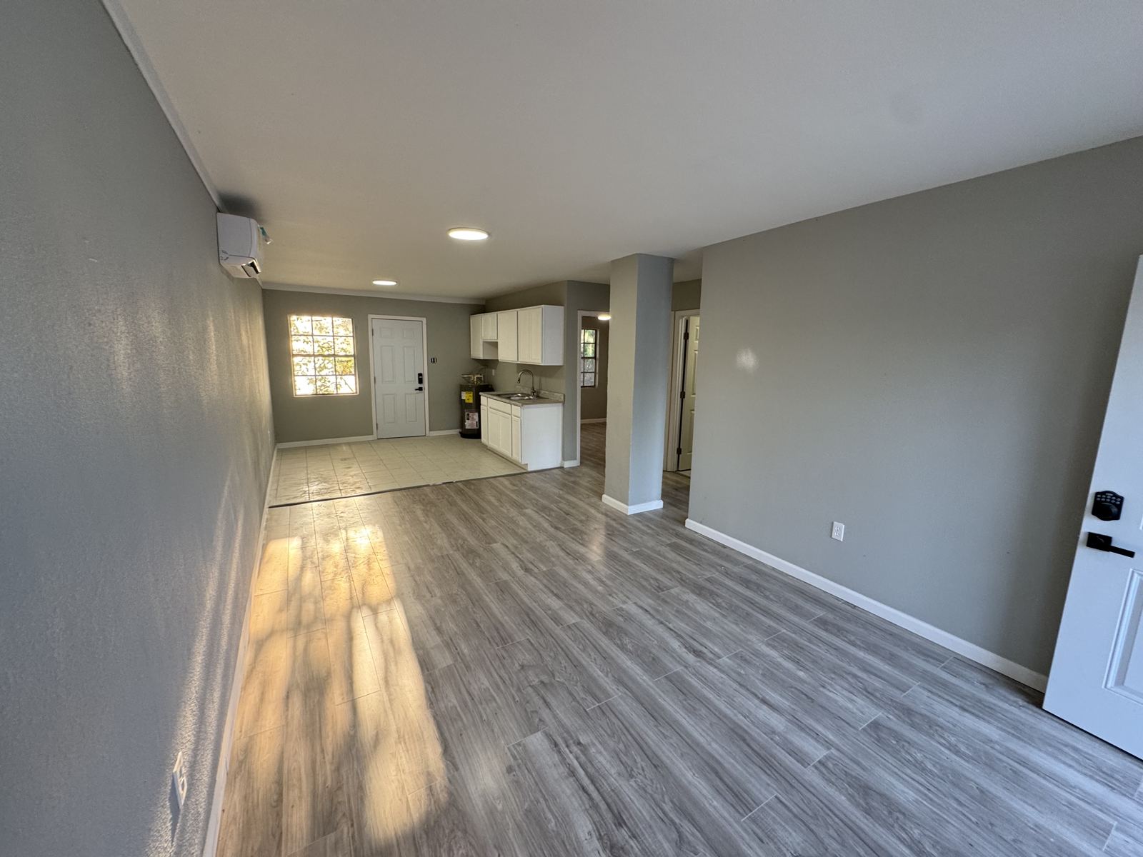 Freshly finished apartment with new drywall, paint and vinyl plank flooring